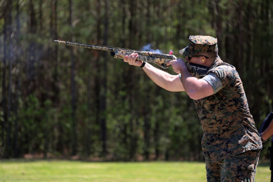 Cpl. Robert Schmitt fires a hunting rifle during a trap and skeet range at Marine Corps Air Station Cherry Point, N.C., April 14, 2016. Twenty Marines with 2nd Low Altitude Air Defense Battalion’s Firearms Mentorship Program utilized their marksmanship skills during the range as part of their firearms safety classes. The mentorship program promotes safe private gun ownership, builds confidence in marksmanship skills and increases Marines combat readiness by familiarizing them with other weapons.  Schmitt is a low altitude air defense gunner with the battalion. (U.S. Marine Corps photo by Cpl. N.W. Huertas/ Released)