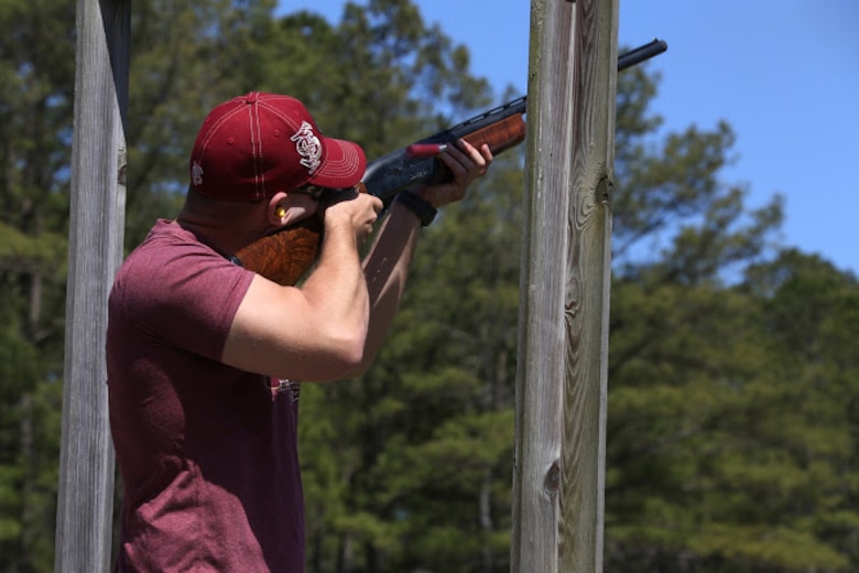 Lance Cpl. David Simmons fires a shotgun during a trap and skeet range at Marine Corps Air Station Cherry Point, N.C., April 14, 2016. Twenty Marines with 2nd Low Altitude Air Defense Battalion’s Firearms Mentorship Program utilized their marksmanship skills during the range as part of their firearms safety classes. The mentorship program promotes safe private gun ownership, builds confidence in marksmanship skills and increases Marines combat readiness by familiarizing them with other weapons.  Simmons is an assistant low altitude air defense gunner with the battalion. (U.S. Marine Corps photo by Cpl. N.W. Huertas/ Released)
