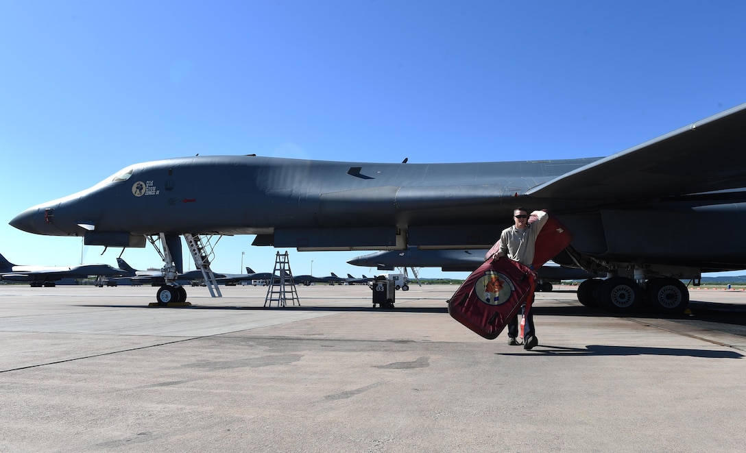 Senior Airman Jason Stach, a 28th Aircraft Maintenance Unit B-1B Lancer aircraft technician, removes the inlet covers from the engines of one of the bombers May 3, 2016, at Dyess Air Force Base, Texas. Stach is responsible for preflight inspections and maintenance on the B-1, which includes checking fluids such as fuel, oil and hydraulics, as well as landing gear and oxygen for the aircraft crew. (U.S. Air Force photo/Senior Airman Alexander Guerrero)