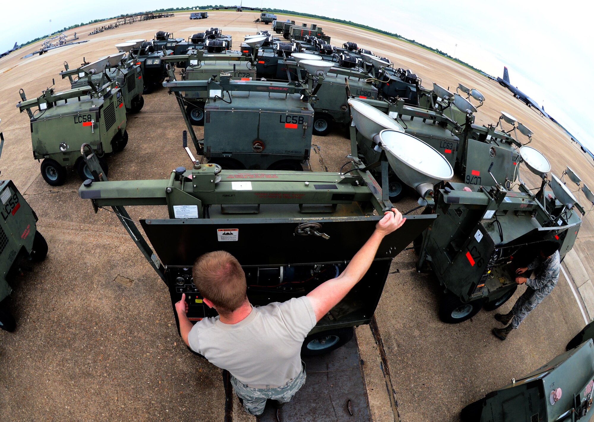 Aerospace ground equipment maintainers from the 2nd Maintenance Squadron perform a flightline inspection at Barksdale Air Force Base, La., May 16, 2016. Airmen in the AGE flight maintain ground equipment to keep aircraft operational. (U.S. Air Force photo/Senior Airman Luke Hill)