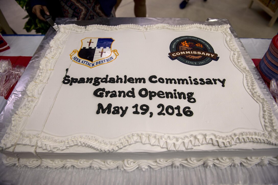 A cake is displayed inside the new Spangdahlem commissary during the grand opening May 19, 2016, at Spangdahlem Air Base, Germany. The new commissary is the first of its kind to incorporate a C02 refrigeration system that cuts down energy costs and reduces the facility's carbon footprint on the environment. (U.S. Air Force photo by Senior Airman Rusty Frank/Released)