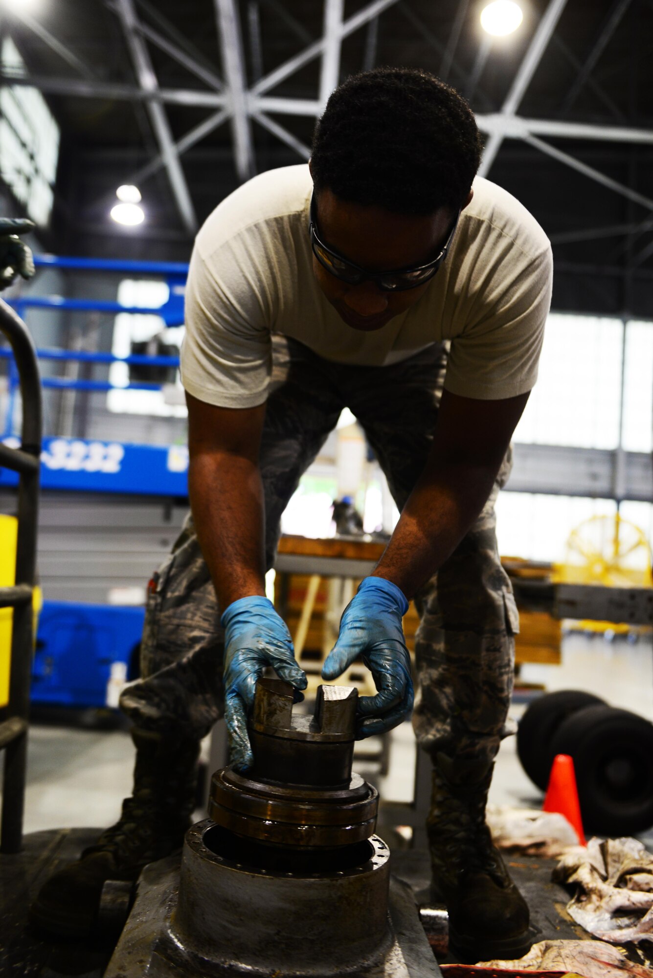 Senior Airman Dawuud Gibson, 2nd Maintenance Squadron aerospace ground equipment maintainer, conducts maintenance on a bomb lift table at Barksdale Air Force Base, La., May 16, 2016. Bomb lift tables are one of various pieces of equipment that AGE Airmen maintain and keep running at 100 percent. (U.S. Air Force photo/Senior Airman Luke Hill)
