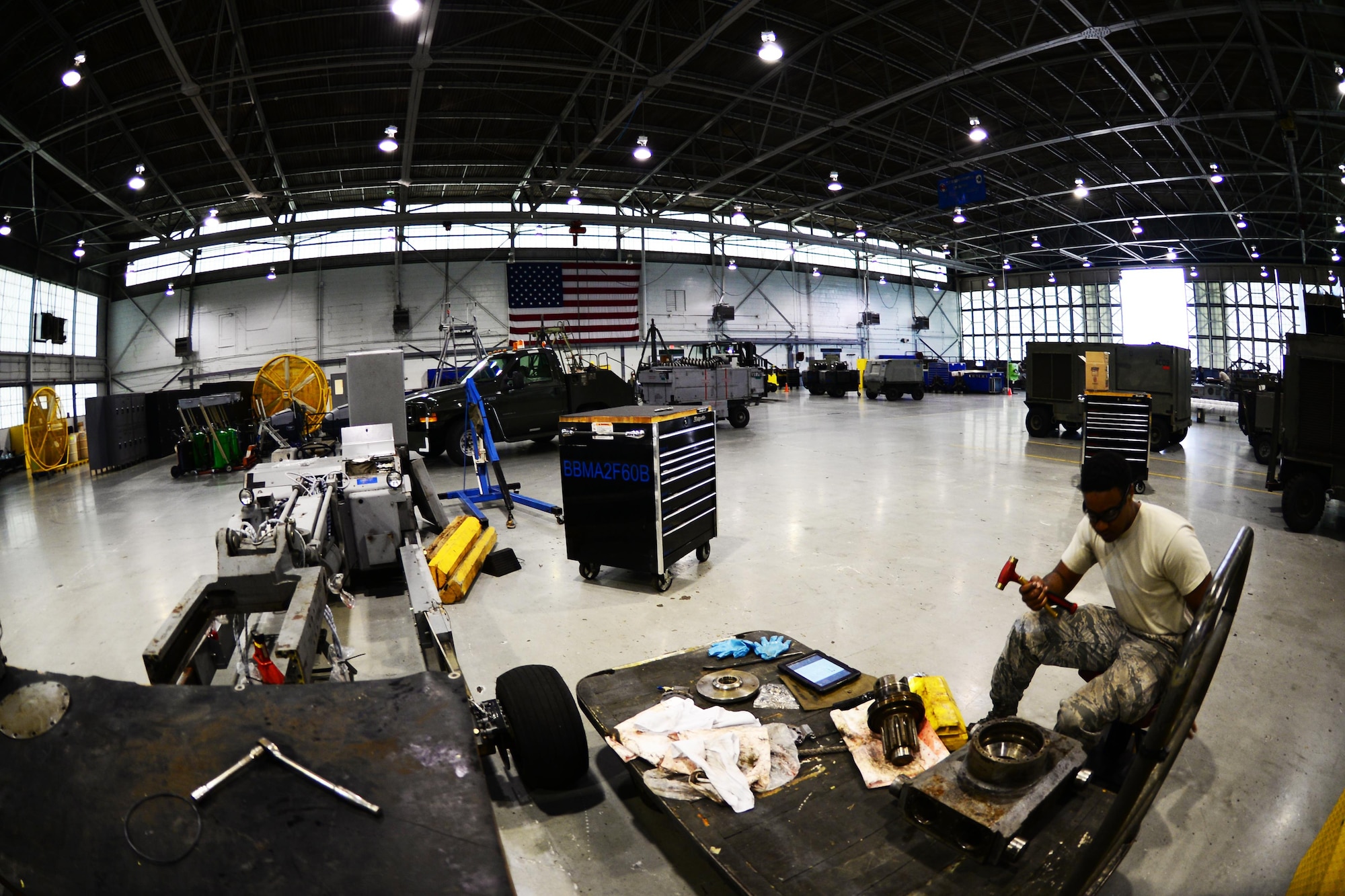 Senior Airman Dawuud Gibson, 2nd Maintenance Squadron aerospace ground equipment maintainer, conducts maintenance on a bomb lift table at Barksdale Air Force Base, La., May 16, 2016. Instead of directly maintaining the B-52 Stratofortress, AGE Airmen maintain equipment such as bomb lifts, scaffolds and equipment used by other maintainers. (U.S. Air Force photo/Senior Airman Luke Hill)