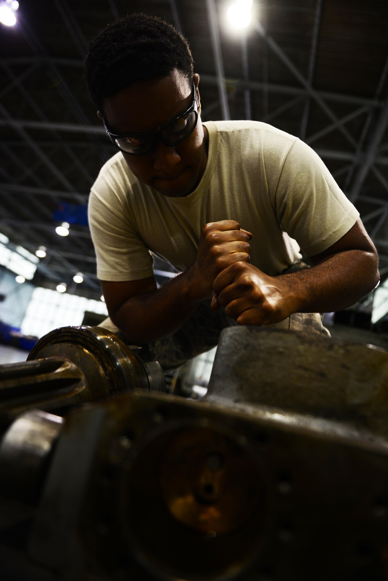 Senior Airman Dawuud Gibson, 2nd Maintenance Squadron aerospace ground equipment maintainer, conducts maintenance on a bomb lift table at Barksdale Air Force Base, La., May 16, 2016. AGE Airmen maintain over 600 different types of equipment needed for maintenance, loading and fueling. (U.S. Air Force photo/Senior Airman Luke Hill)