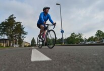A Ramstein member compete in the bike portion of the Michael Hill Memorial Triathlon at Ramstein Air Base, Germany, May 14, 2016. The triathlon was held in memory of Airman 1st Class Michael Hill who was assigned to the 786th Civil Engineer Squadron as a heavy equipment operator before suddenly losing his life nearly one year ago in a fatal car accident. (U.S. Air Force photo by/Tech Sgt. Sara Keller)