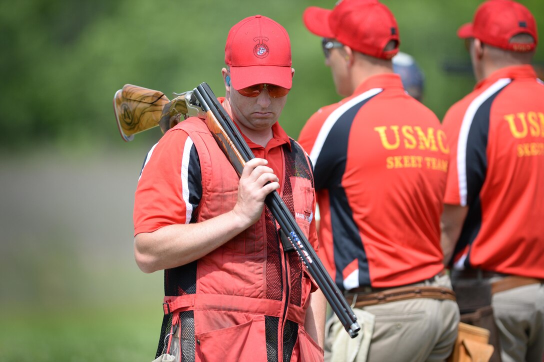 Marine Corps Gunnery Sgt. Mark Stewart, foreground, reflects after shooting skeet at the 2016 Armed Services Skeet Championships outside Nashville, Tenn., May 10, 2016. Stewart is a member of the Marine Corps skeet team. DoD photo by Marvin D. Lynchard