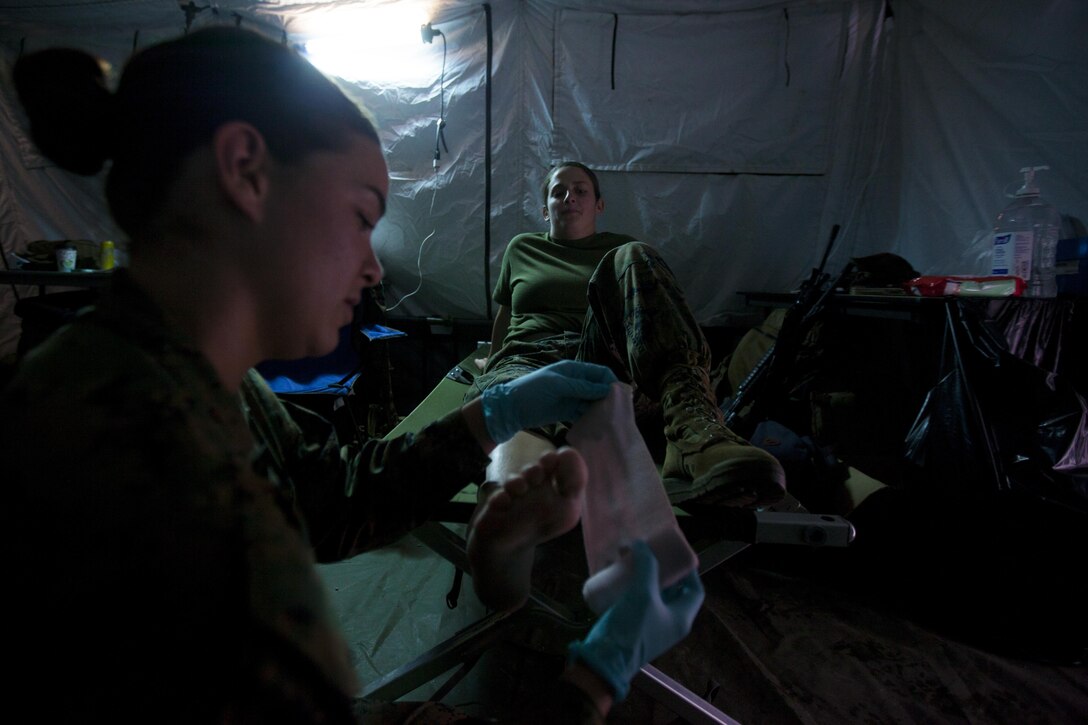 U.S. Navy Seaman 1st Class Alexis L. Ruiall practices providing aid to a sprained ankle during 2nd Marine Aircraft Wing’s portion of the II Marine Expeditionary Force Exercise 2016 at Marine Corps Air Station Cherry Point, N.C., May 13, 2016. MEFEX 16 is designed to synchronize and bring to bear the full spectrum of II MEF’s command and control capabilities in support of the Marine Air-Ground Task Force.   Ruiall is a corpsman with Marine Tactical Electronic Warfare Squadron 2. (U.S. Marine Corps photo by Cpl. Austin A. Lewis/Released)