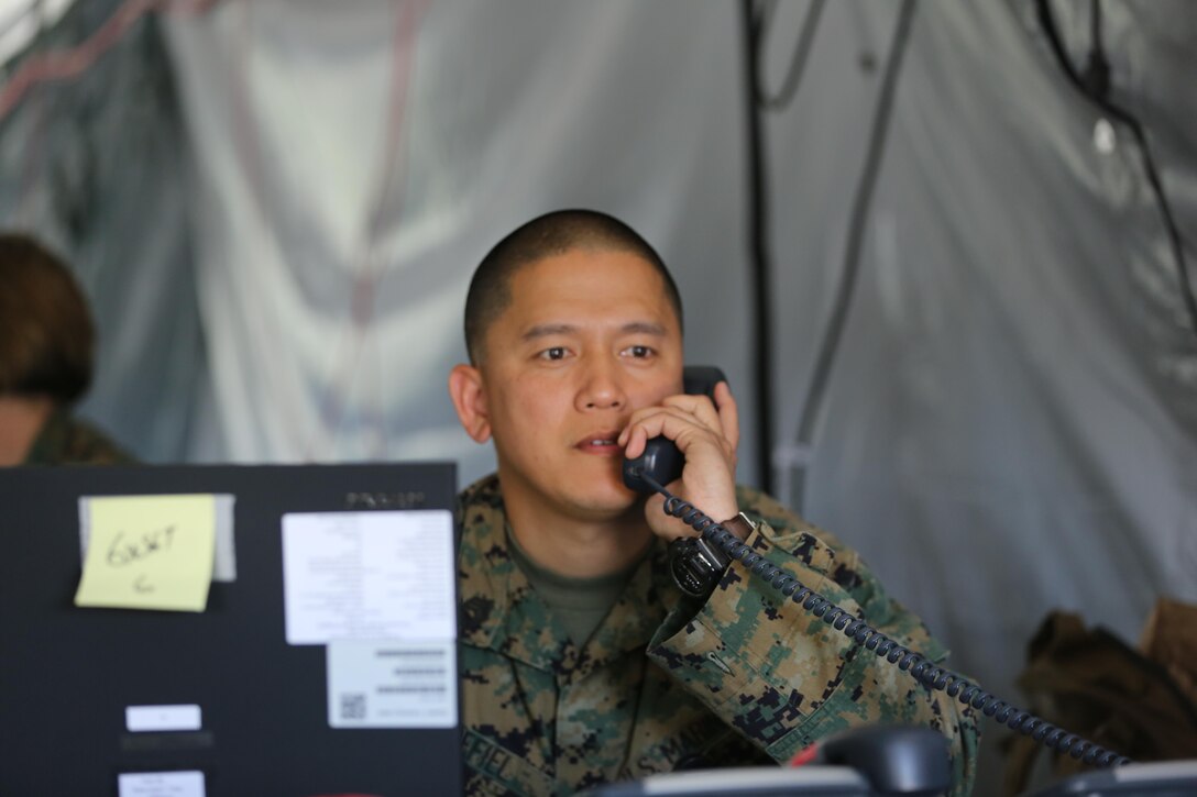 Gunnery Sgt. Edgar R. Grefiel makes a phone call during 2nd Marine Aircraft Wing’s portion of the II Marine Expeditionary Force Exercise 2016 at Marine Corps Air Station Cherry Point, N.C., May 15, 2016.  MEFEX 16 is designed to synchronize and bring to bear the full spectrum of II MEF’s command and control capabilities in support of the Marine Air-Ground Task Force. Grefiel is an administrative operations chief with Marine Wing Headquarters Squadron 2.  (U.S. Marine Corps photo by Lance Cpl. Mackenzie Gibson/Released)