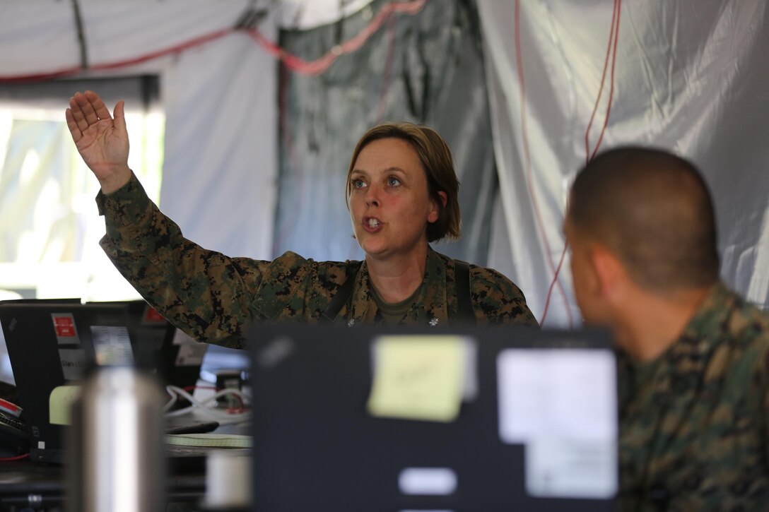 Lt. Col. Regina Gustavsson explains the circumstances of a simulated mishap during 2nd Marine Aircraft Wing’s portion of the II Marine Expeditionary Force Exercise 2016 at Marine Corps Air Station Cherry Point, N.C., May 11, 2016.  MEFEX 16 is designed to synchronize and bring to bear the full spectrum of II MEF’s command and control capabilities in support of the Marine Air-Ground Task Force. Gustavsson is the assistant chief of staff, G-1 administration, 2nd MAW. (U.S. Marine Corps photo by Lance Cpl. Mackenzie Gibson/Released)