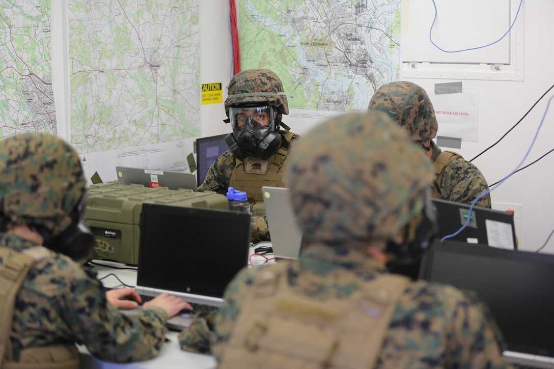 Marines continue to work while wearing their gas masks during a mock chemical, biological, radiological and nuclear defense drill, during 2nd Marine Aircraft Wing’s portion of the II Marine Expeditionary Force Exercise 2016 at Marine Corps Air Station Cherry Point, N.C., May 15, 2016. During MEFEX 16, 2nd MAW conducted an incoming CBRN drill to ensure that the Marines knew how to react quickly and use their equipment properly. MEFEX 16 is designed to synchronize and bring to bear the full spectrum of II MEF’s command and control capabilities in support of the Marine Air-Ground Task Force.   (U.S. Marine Corps photo by Staff Sgt. Rebekka S. Heite/Released)