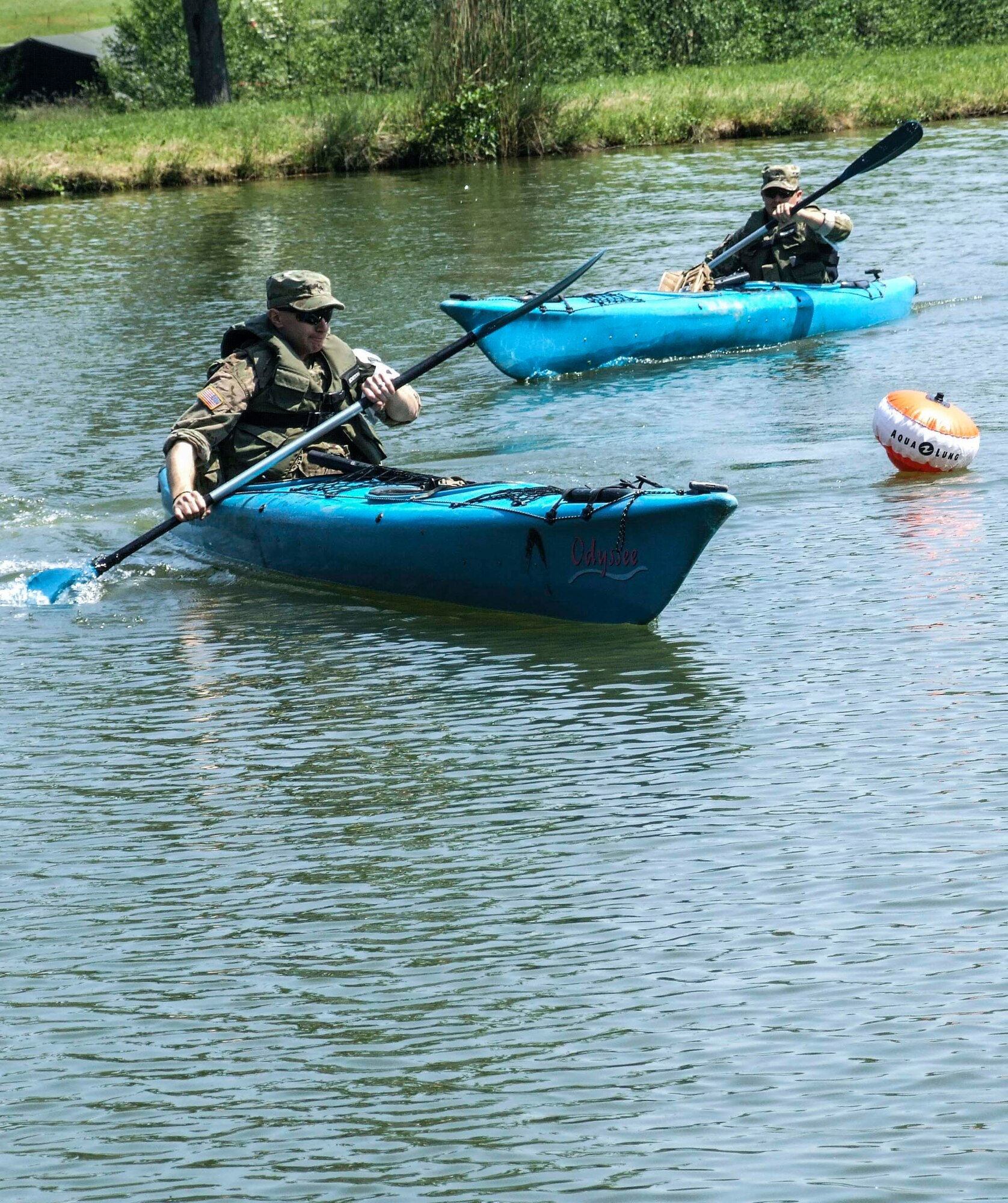 A U.S. Soldier and Airmen complete the kayaking challenge as part of one of the challenges during the Croatian Best Soldier Competition in Grubišno Polje, Croatia, May 12, 2016. Nine U.S. service members, including five Airmen were among the first U.S. service members to ever complete the multi-day challenge that included 28 check points and 12 work stations that challenged competitors in the shooting, medical care, kayaking, weapons assembly and more. (Courtesy photo)