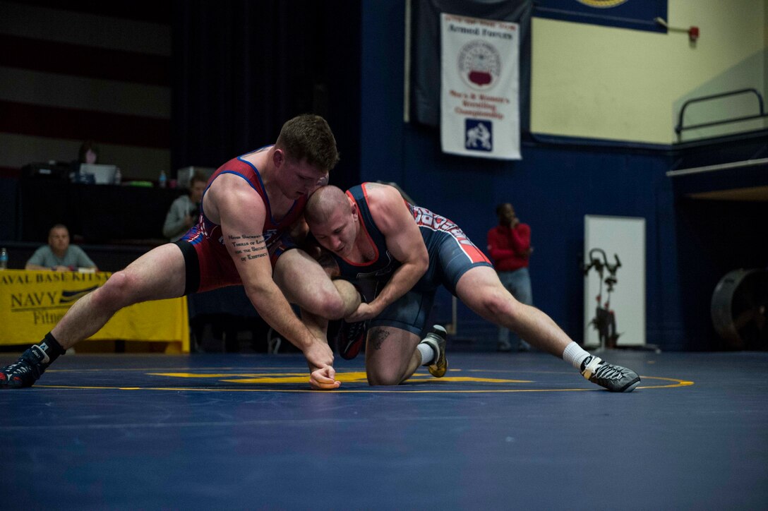 Air Force 1st Lt. Clayton Gable, right, a 2nd Space Warning Squadron supervisory statistician, competes in the 190-pound weight class at the Armed Forces Championships at Naval Base Kitsap, Wash., Feb. 21, 2016. Gable wrestled for the U.S. Air Force Academy and is now part of the Air Force wrestling team. Navy photo by Petty Officer 2nd Class Cory Asato