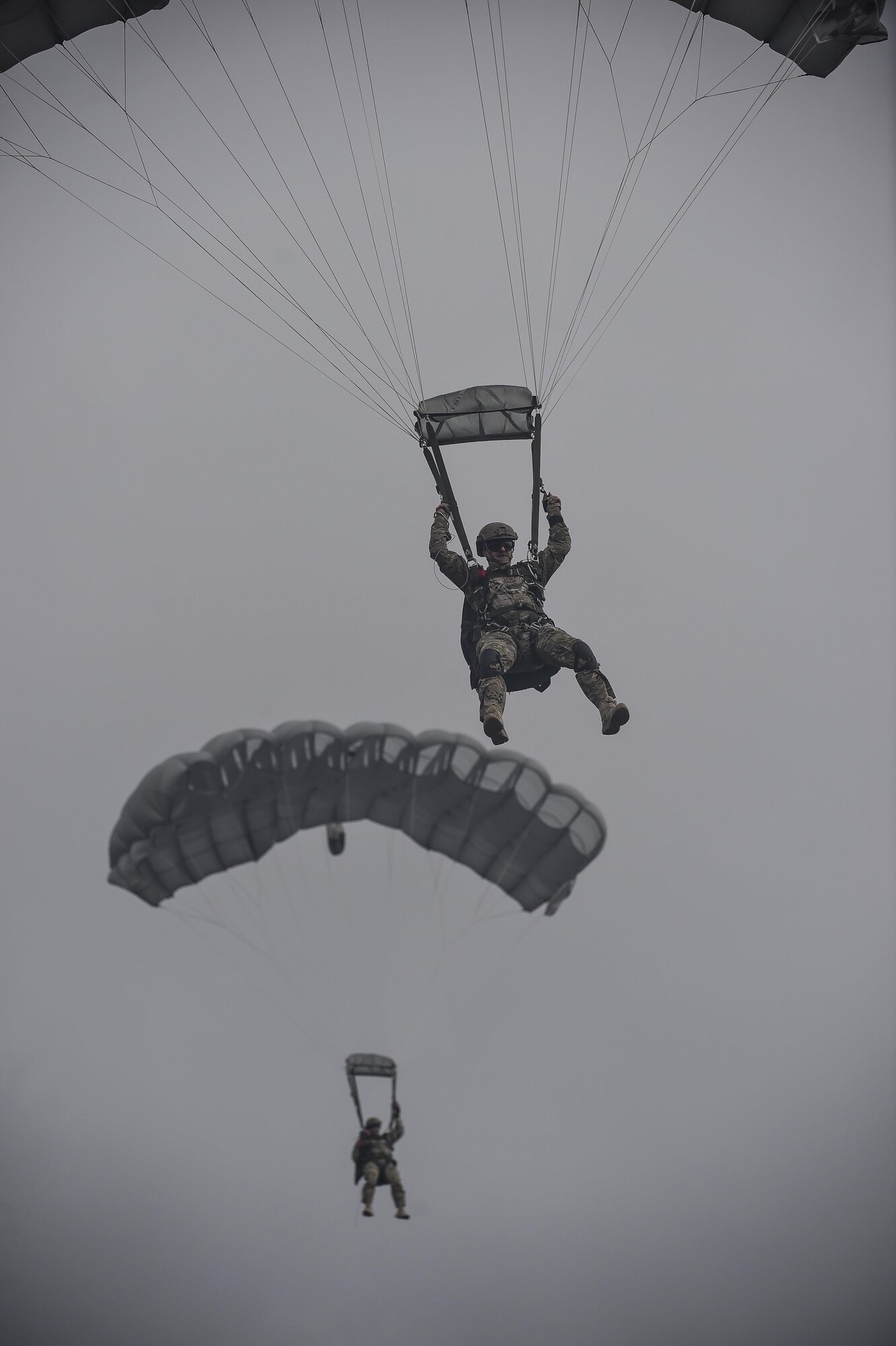 Chief Master Sgt. Bruce W. Dixon, the command chief master sergeant of the 24th Special Operations Wing, descends during his final military jump at Hurlburt Field, Fla., May 3, 2016. Dixon served 30 years as a combat controller, earning the title of master parachutist with more than 400 military jumps including three combat jumps in Afghanistan. In total, he spent ten of those thirty years away from his family, consistently serving his nation's call in dangerous ground combat and training. (U.S. Air Force photo by Airman 1st Class Kai White)