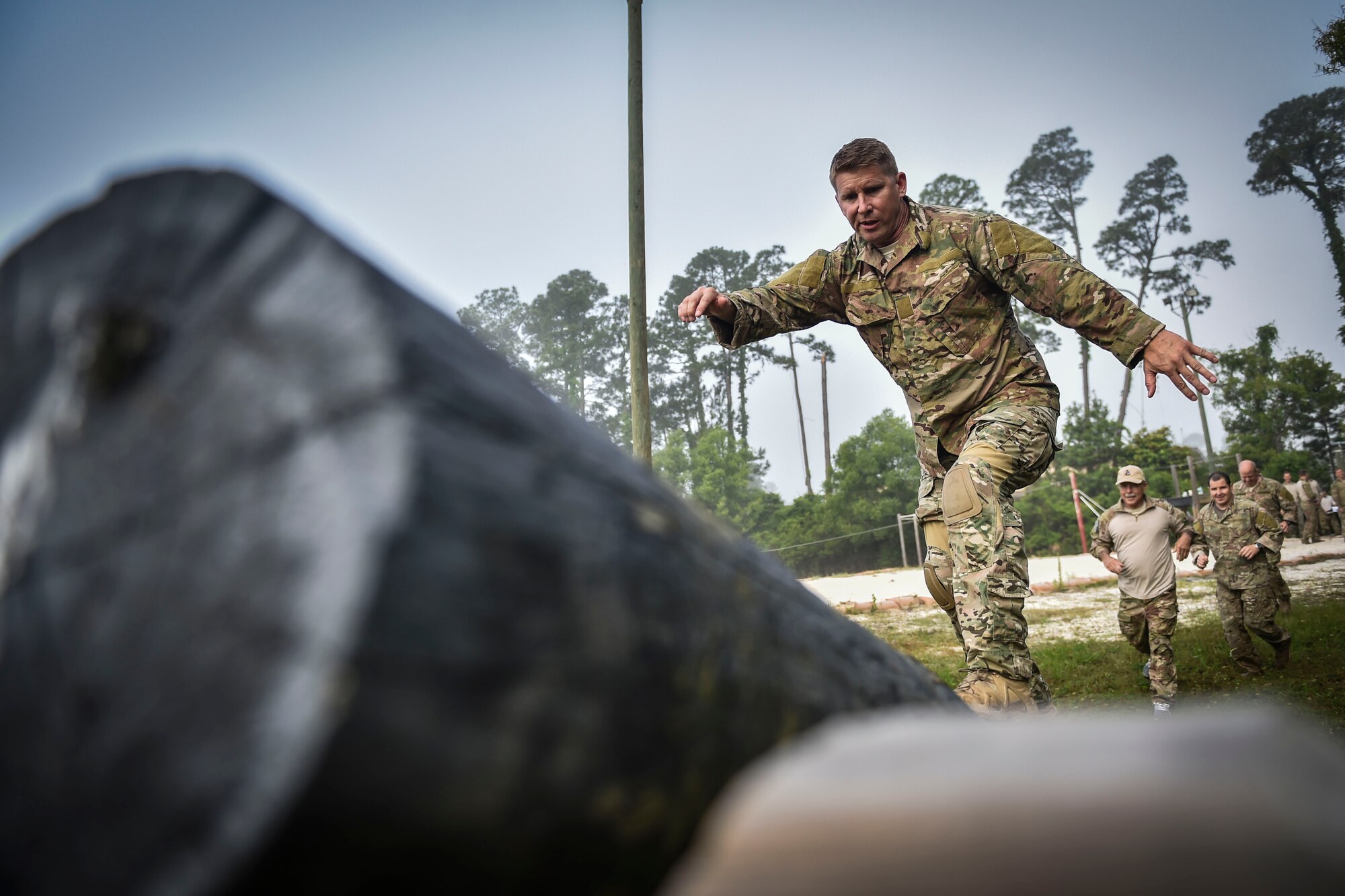 Special Tactics members assigned to the 24th Special Operations Wing complete an obstacle during a Monster Mash at Hurlburt Field, Fla., May 12, 2016. Monster Mash is a long-standing Special Tactics training tradition, consisting of an obstacle course where special operators complete timed scenarios at different stations of core mission training. The event was held in honor of Chief Master Sgt. Bruce W. Dixon, the command chief of the 24th SOW, who is retiring after a 30-year career as a combat controller. (U.S. Air Force photo by Senior Airman Ryan Conroy)   