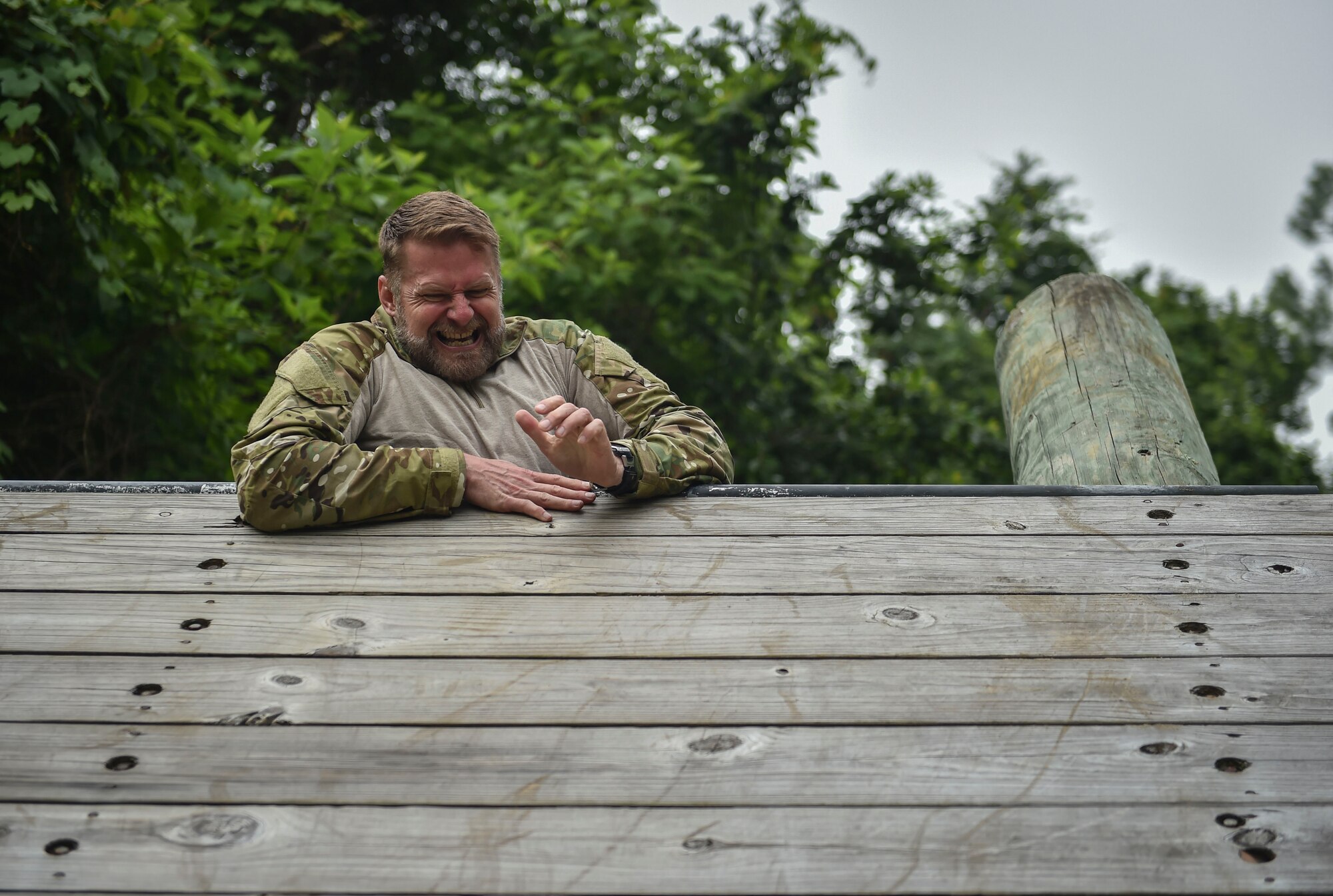 Retired Col. Eric Ray, previous vice commander of the 24th Special Operations Wing, attempts to overcome an obstacle during a Monster Mash at Hurlburt Field, Fla., May 12, 2016. Monster Mash is a long-standing Special Tactics training tradition, consisting of an obstacle course where special operators complete timed scenarios at different stations of core mission training. The event was held in honor of Chief Master Sgt. Bruce W. Dixon, the command chief of the 24th SOW, who is retiring after a 30-year career as a combat controller. (U.S. Air Force photo by Senior Airman Ryan Conroy) 