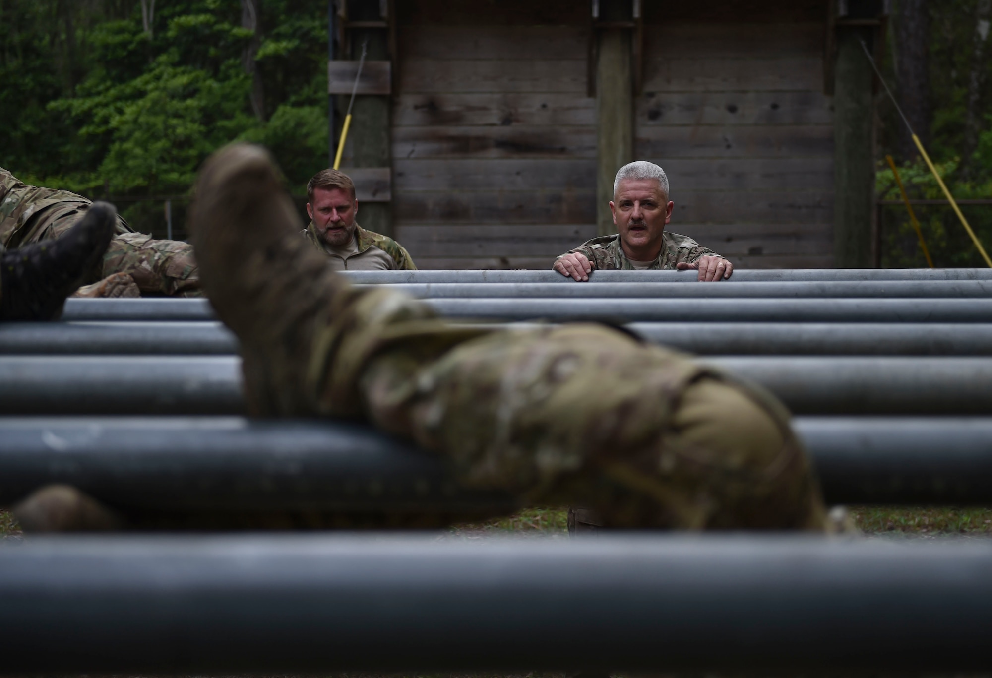 Chief Master Sgt. Bruce W. Dixon, the command chief master sergeant of the 24th Special Operations Wing, prepares to overcome an obstacle during a Monster Mash at Hurlburt Field, Fla., May 12, 2016. Monster Mash is a long-standing Special Tactics training tradition, consisting of an obstacle course where special operators complete timed scenarios at different stations of core mission training. The event was held in honor of Dixon, who is retiring after a 30-year career as a combat controller. (U.S. Air Force photo by Senior Airman Ryan Conroy) 