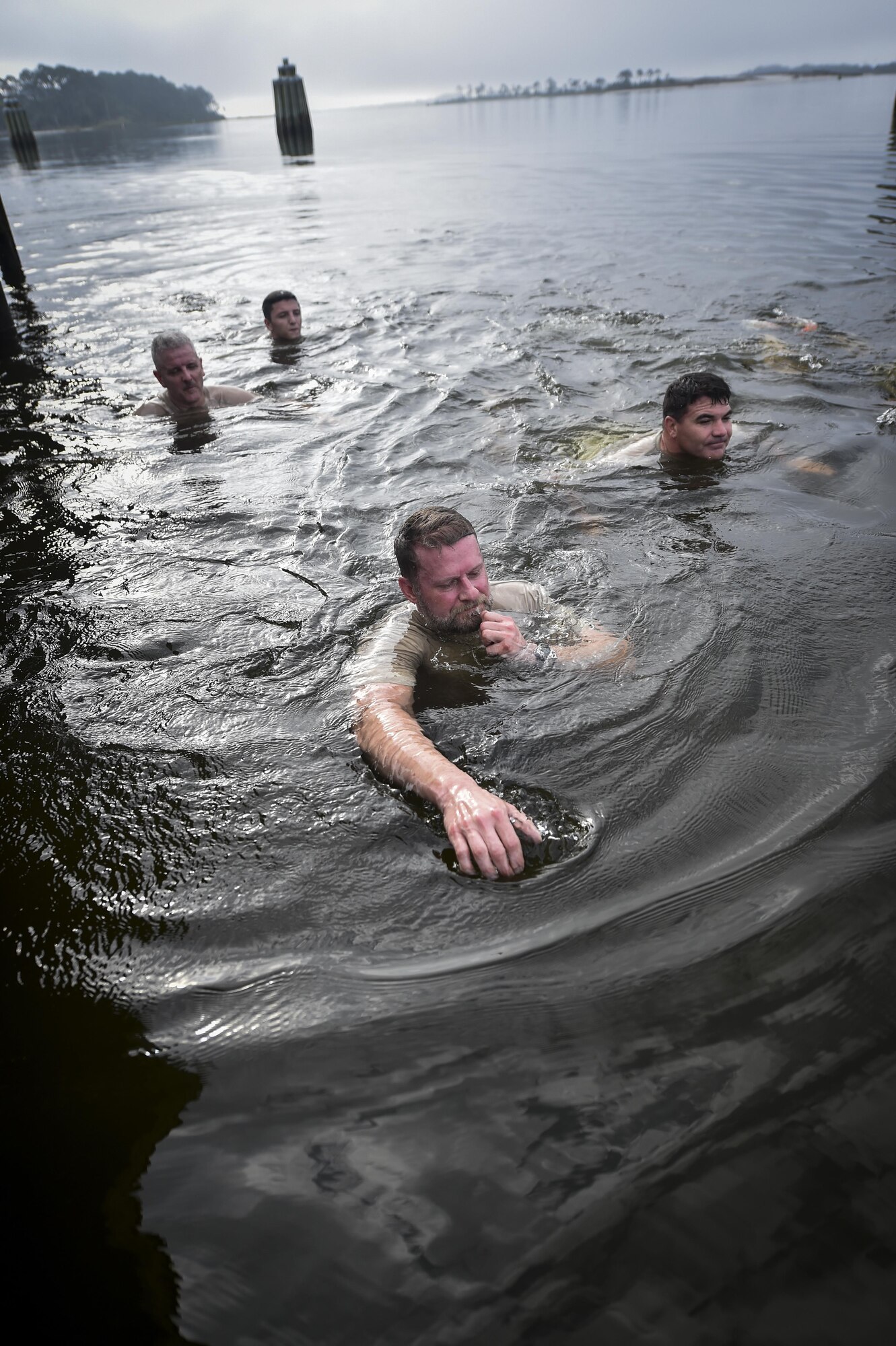 Monster Mash Team 4 completes the swimming portion of a Monster Mash at Hurlburt Field, May 12, 2016. Monster Mash is a long-standing Special Tactics training tradition, consisting of an obstacle course where special operators complete timed scenarios at different stations of core mission training. The event was held in honor of Chief Master Sgt. Bruce W. Dixon, the command chief of the 24th Special Operations Wing, who is retiring after a 30-year career as a combat controller. (U.S. Air Force photo by Senior Airman Ryan Conroy) 