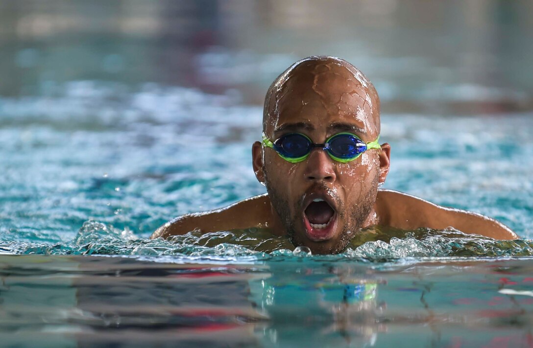 An Airman performs the swimming portion of the Michael Hill Memorial Triathlon at Ramstein Air Base, Germany, May 14, 2016. The triathlon was held in memory of Airman 1st Class Michael Hill who was assigned to the 786th Civil Engineer Squadron as a heavy equipment operator before suddenly losing his life nearly one year ago in a fatal car accident. The triathlon included three portions; 275 m swim, 20 km bike and 5 km run. All proceeds collected for the event were donated to a charity in Michael Hill’s name. (U.S. Air Force photo by/Tech. Sgt. Sara Keller)
