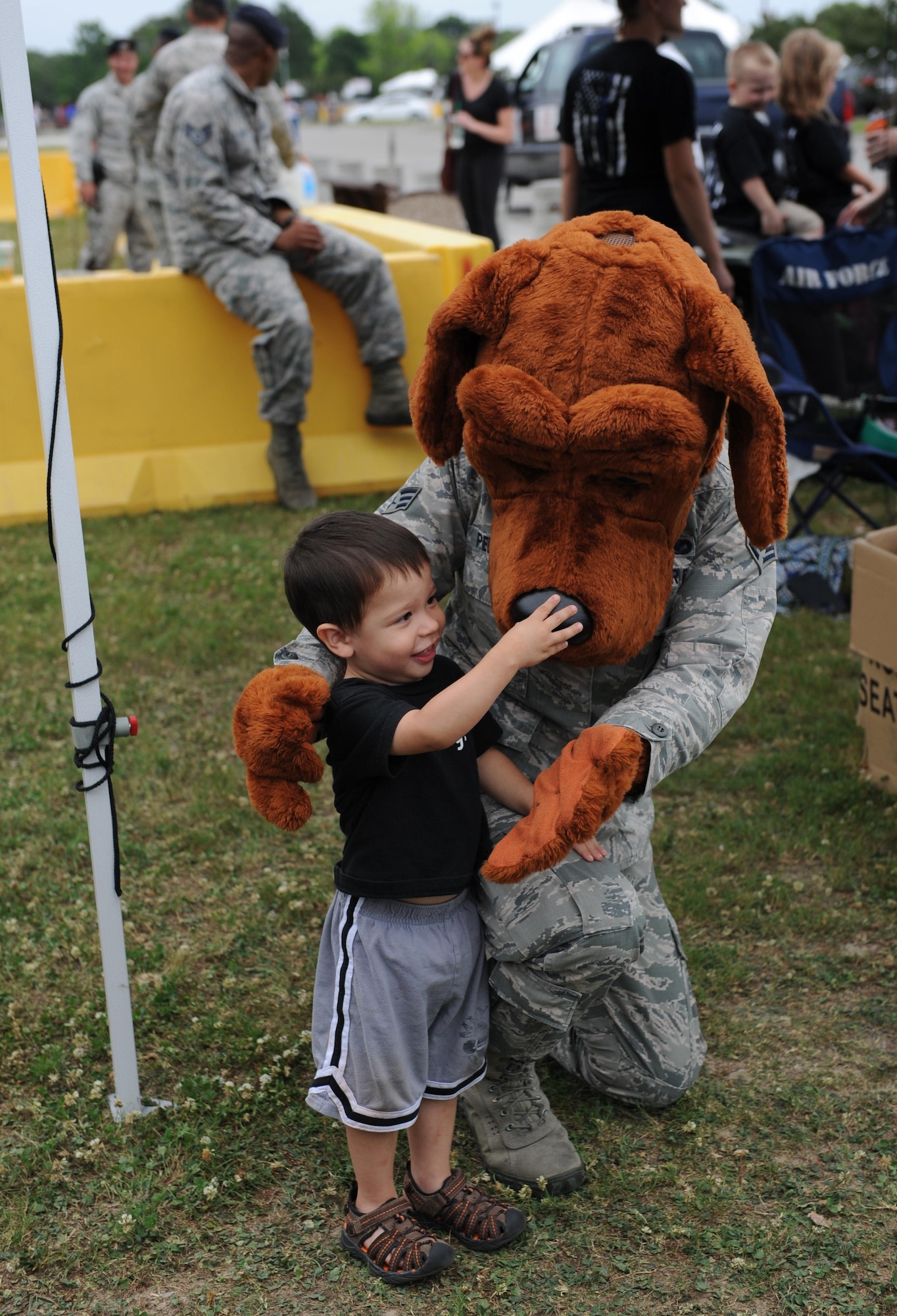 Milo Pedroza, son of Senior Airman Elizabeth Pedroza, 81st Security Forces Squadron entry controller, receives a hug from McGruff the Crime Dog during the 81st SFS Fun Day at the base exchange May 16, 2016, Keesler Air Force Base, Miss. The event was held during National Police Week, which recognizes the service of law enforcement men and women who put their lives at risk every day. (U.S. Air Force photo by Kemberly Groue)