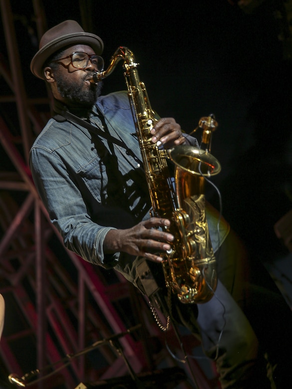 A saxophone player performs alongside Meghan Linsey during the We Salute You Celebration at Lance Cpl. Torrey L. Gray Field May 7, 2016. Marine Corps Community Services hosted the event to provide local entertainment to Marines and sailors aboard the Combat Center. (Official Marine Corps photo by Lance Cpl. Levi Schultz/Released)