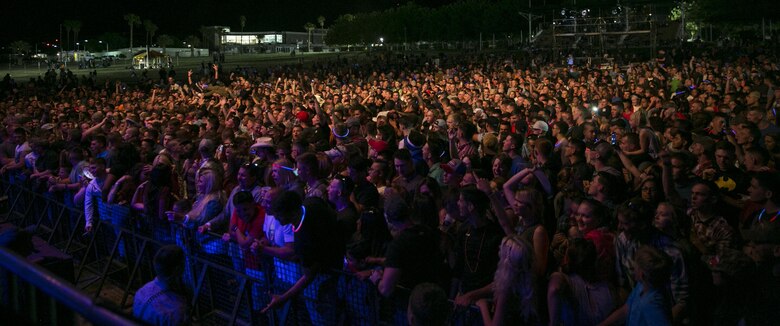 Combat Center patrons listen to Trace Adkins perform at the We Salute You Celebration at Lance Cpl. Torrey L. Gray Field May 7, 2016. Marine Corps Community Services hosted the event to provide local entertainment to Marines and sailors aboard the Combat Center. (Official Marine Corps photo by Lance Cpl. Dave Flores)