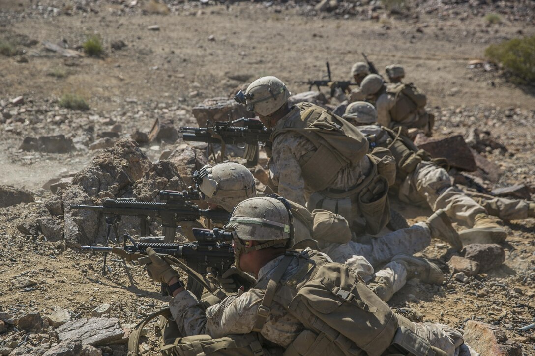 Marines with 2nd Battalion, 8th Marine Regiment, position themselves to lay down suppressive fire at Range 410 while participating in Integrated Training Exercise 3-16 aboard Marine Corps Air Ground Combat Center, Twentynine Palms, Calif., May 9, 2016. 2/8 came from Marine Corps Base Camp Lejeune, N.C., to participate in ITX 3-16. (Official Marine Corps photo by Lance Cpl. Dave Flores/Released)