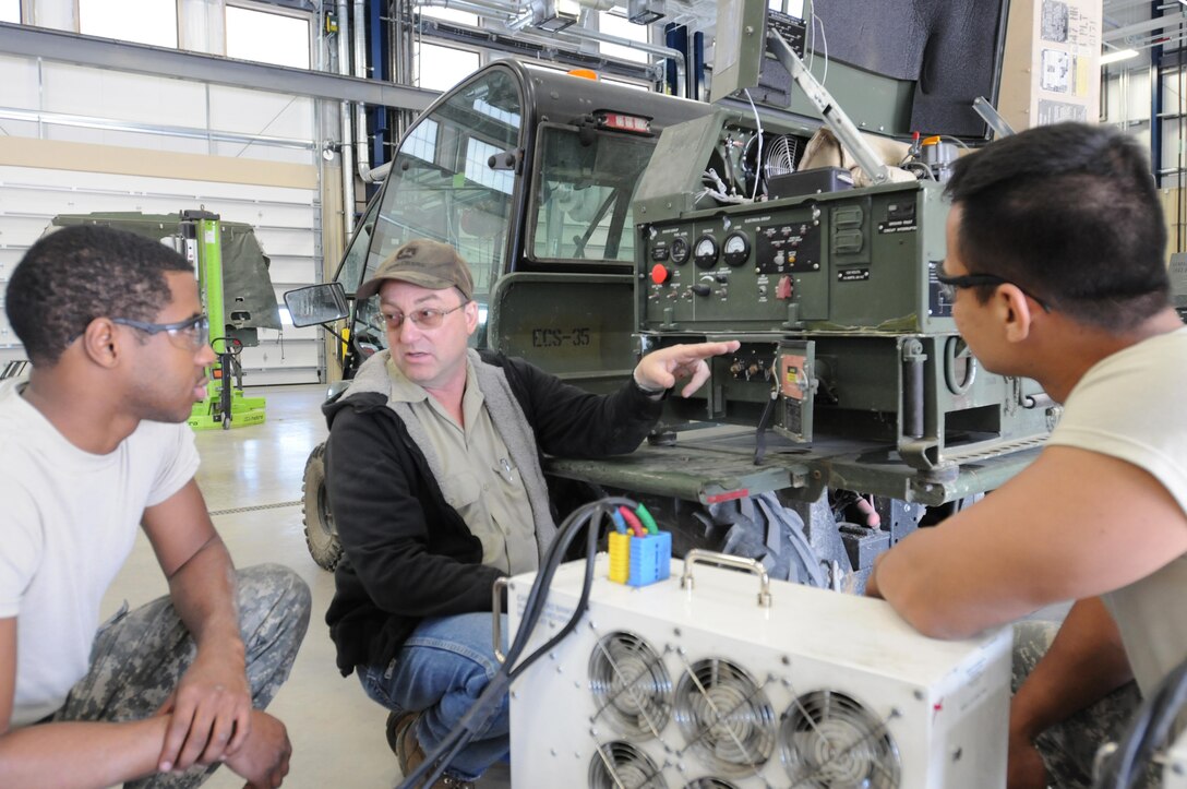 Military Technician Michael Esser conducts maintenance training on a generator with Army Reserve Soldiers Spc. John Channer and Sgt. Suman Lama of the 818th Maintenance Support Co. at the 88th Regional Support Command’s Equipment Concentration Site 67 on Fort McCoy Wis., May 18.

These Soldiers represent the more than 300 service members who will be conducting real-world hands-on training with the 88th RSC this year as part of Operation Platinum Support. The goal of operation is to allow Army Reserve Soldiers in low-density supply and maintenance specialties to perform and gain proficiency in their technical skills while acting in direct support to the numerous exercises taking place on Fort McCoy.
By the completion of Operation Platinum Support, these supply and maintenance Soldiers will have processed and inventoried thousands of pieces of equipment and are projected to complete more than 100 service and repair work orders.