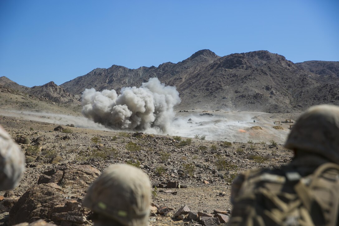 Marines with 2nd Battalion, 8th Marine Regiment, observe as combat engineers lay down mine clearing line charges to clear the path Range 410 while participating in Integrated Training Exercise 3-16 aboard Marine Corps Air Ground Combat Center, Twentynine Palms, Calif., May 9, 2016. 2/8 came from Marine Corps Base Camp Lejeune, N.C., to participate in ITX 3-16. (Official Marine Corps photo by Lance Cpl. Dave Flores/Released)