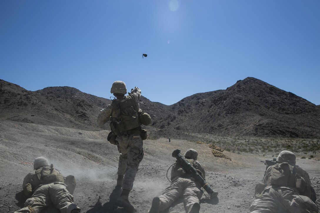 Sgt. Kyle Kimbriel, squad leader, 2nd Battalion, 8th Marine Regiment, throws an M67 hand grenade to clear out targets on at Range 410 while participating in Integrated Training Exercise 3-16 aboard Marine Corps Air Ground Combat Center, Twentynine Palms, Calif., May 9, 2016. 2/8 came from Marine Corps Base Camp Lejeune, N.C., to participate in ITX 3-16. (Official Marine Corps photo by Lance Cpl. Dave Flores/Released)