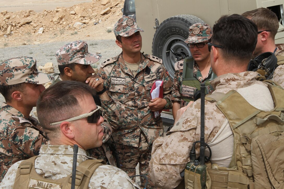 Jordanian Armed Forces and U.S. Marines discuss tactics after a Cobra Helicoptor Quick Reaction Force drill during Exercise Eager Lion 2016 near Amman, Jordan, 18 May, 2016. Eager Lion 16 is a bi-lateral exercise in the Hashemite Kingdom of Jordan between the JAF and the U.S. Military designed to strengthen relationships and interoperability between partner nations. (U.S. Army Reserve photo by Spc. Ian Valley 366 Mobile Public Affairs Detachment.)