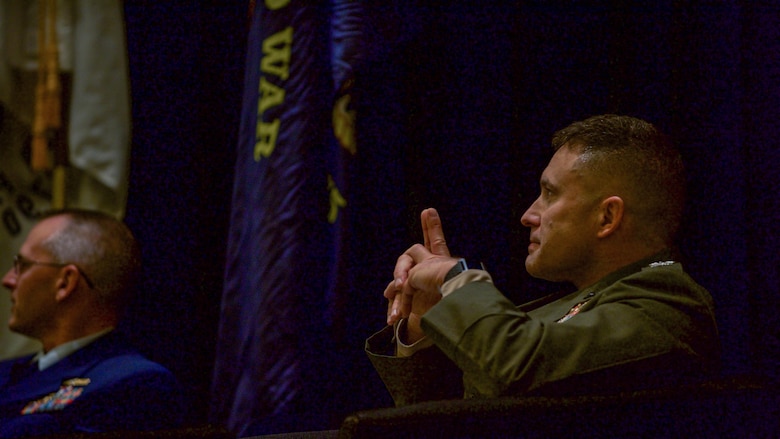 Col. James Jenkins, director for the Science and Technology Division, Marine Corps Warfighting Laboratory/Future Directorates, Marine Corps Combat Development Command, observes a presentation on technology in the military during the Evolution of the Human Machine Team panel at the Gaylord National Convention Center at National Harbor, Maryland, May 17, 2016, as part of the Navy League of the United States Sea, Air, Space Exposition.