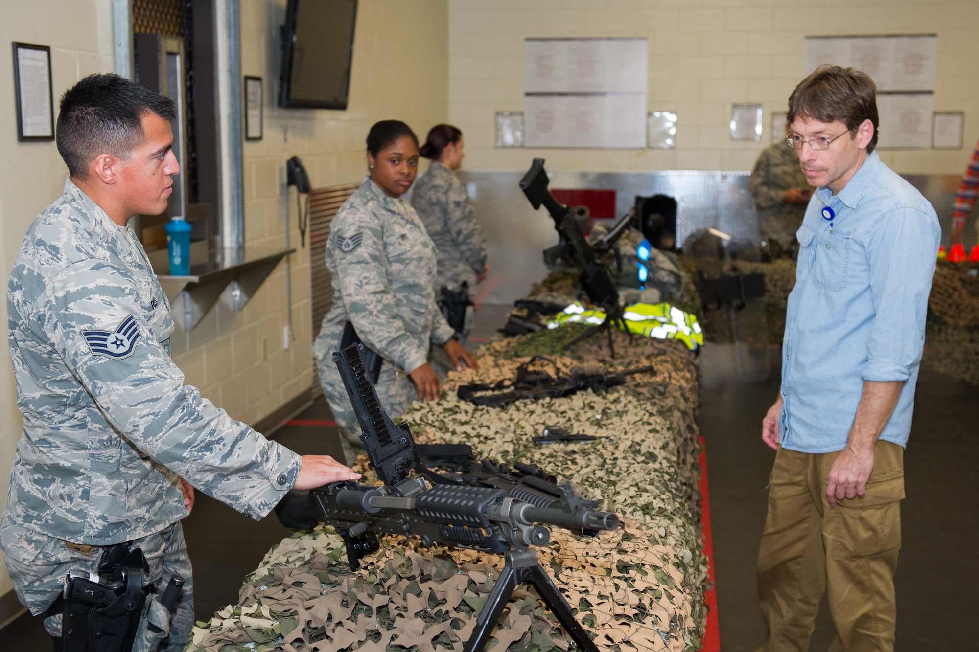 The 45th Security Forces Squadron held an open house at Patrick Air Force Base, Fla., May 18, 2016, during National Police Week, to honor all law enforcement and first responders who have made the ultimate sacrifice. The open house included a Military Working Dog demonstration and a tour of the holding cells, dispatch center, mobile command post, weapons display, and patrol vehicles. This year’s National Police Week dates are May 15-21. (U.S. Air Force photos/Benjamin Thacker/Released)