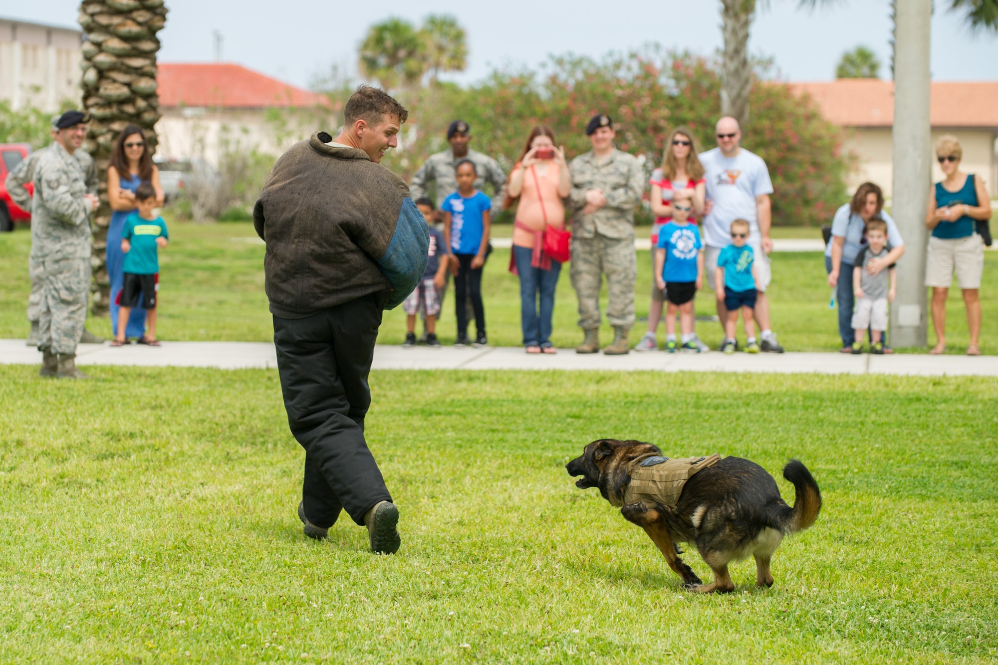 The 45th Security Forces Squadron held an open house at Patrick Air Force Base, Fla., May 18, 2016, during National Police Week, to honor all law enforcement and first responders who have made the ultimate sacrifice. The open house included a Military Working Dog demonstration and a tour of the holding cells, dispatch center, mobile command post, weapons display, and patrol vehicles. This year’s National Police Week dates are May 15-21. (U.S. Air Force photos/Benjamin Thacker/Released)