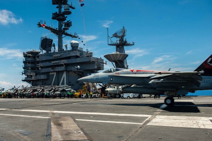 160511-N-MY174-043 SOUTH CHINA SEA (May 11, 2016) - Capt. Richard Brophy, commander, Carrier Air Wing (CVW) 9 lands an F/A-18E Super Hornet assigned to the Tophatters of Strike Fighter Squadron (VFA) 14 on USS John C. Stennis' (CVN 74) flight deck during routine flight operations. This marks Brophy's 1,000th arrested landing on an aircraft carrier. Providing a ready force supporting security and stability in the Indo-Asia-Pacific, John C. Stennis is operating as part of the Great Green Fleet on a regularly scheduled 7th Fleet deployment. (U.S. Navy photo by Mass Communication Specialist Seaman Tomas Compian/Released)