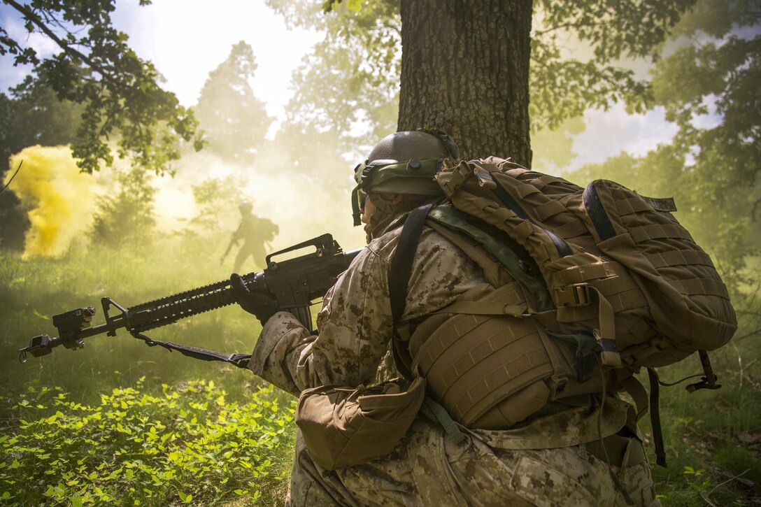 A Marine provides cover during a field training exercise for military police at Fort Leonard Wood, Mo., May 11, 2016. Marine Corps photo by Sgt. James R. Skelton