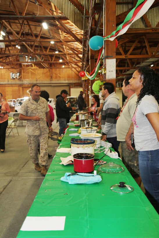 Chief Warrant Officer Randy Hernandez, branch head for Fleets Support Division's maintenance section, views the line of chili entries to figure out which one he will taste first, during FSD's annual Chili Cook-off May 5, aboard MCLB Barstow's Yermo Annex. The cook-off is held annually to raise funds for FSD's employee recognition day, which is held later in the year.