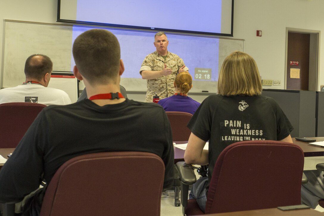 Colonel Terence D. Trenchard welcomes participants to the 2016 Marine Corps Recruiting Command Coaches Workshop aboard Marine Corps Base Quantico, Virginia, May 19, 2016. The Coaches Workshop helps build meaningful and purposeful relationship with those who have the privilege to guide America's leaders of tomorrow. Trenchard currently serves as the chief of staff for MCRC.
