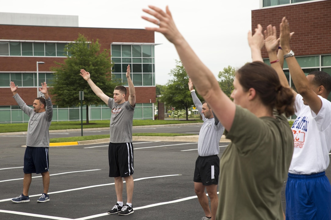 Collegiate sports coaches from across the nation physically train with Marines as part of the 2016 Coaches Workshop in Dumfries, Virginia, May 19, 2016. During the three-day workshop, Marines demonstrate the importance of leadership and ethics in the Corps. 