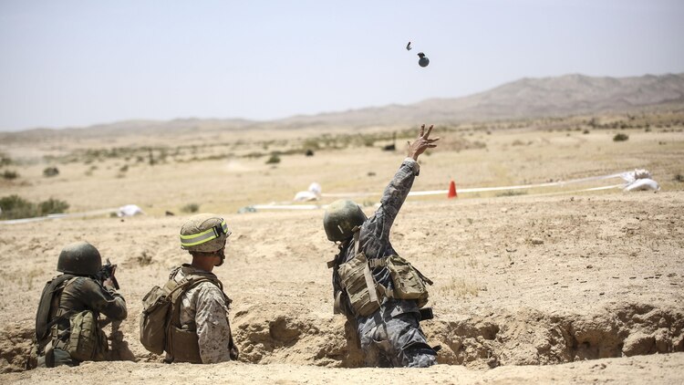 A member of the Jordanian 77th Marines Battalion prepares tosses a training grenade during an explosive weapons range in Al Quweyrah, Jordan, May 16, 2016. Eager Lion is a recurring exercise between partner nations designed to strengthen military-to-military relationships, increase interoperability, and enhance regional security and stability.