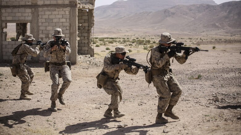 Marines with 1st Battalion, 2nd Marine Regiment, 2nd Marine Division advance to clear a room during a military operations in urban terrain tactics exercise in Al Quweyrah, Jordan, May 16, 2016. Eager Lion is a recurring exercise between partner nations designed to strengthen military-to-military relationships, increase interoperability, and enhance regional security and stability.