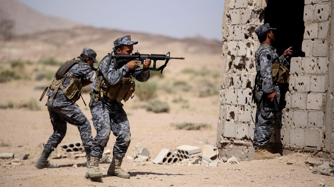 Members of the Jordanian 77th Marines Battalion advance to clear a room during a military operation in urban terrain tactics exercise in Al Quweyrah, Jordan, May 16, 2016. Eager Lion is a recurring exercise between partner nations designed to strengthen military-to-military relationships, increase interoperability, and enhance regional security and stability.
