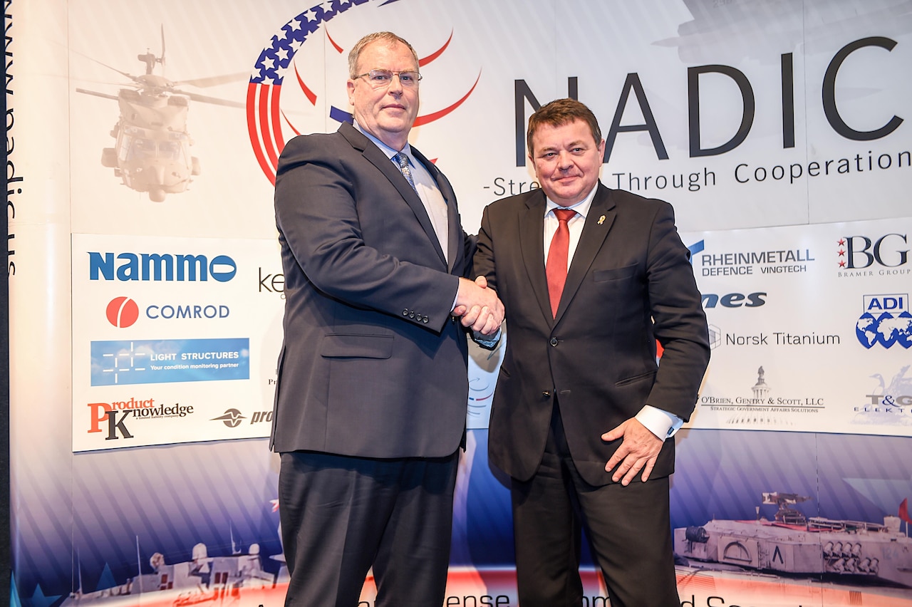 Deputy Defense Secretary Bob Work poses for a photo with his Norwegian counterpart at the Norwegian-American Defense Industry/Homeland Security Council's fourth annual Norwegian-American Defense Conference at the National Press Club in Washington, D.C.,  May 19, 2016. DoD photo by Army Sgt. 1st Class Clydell Kinchen