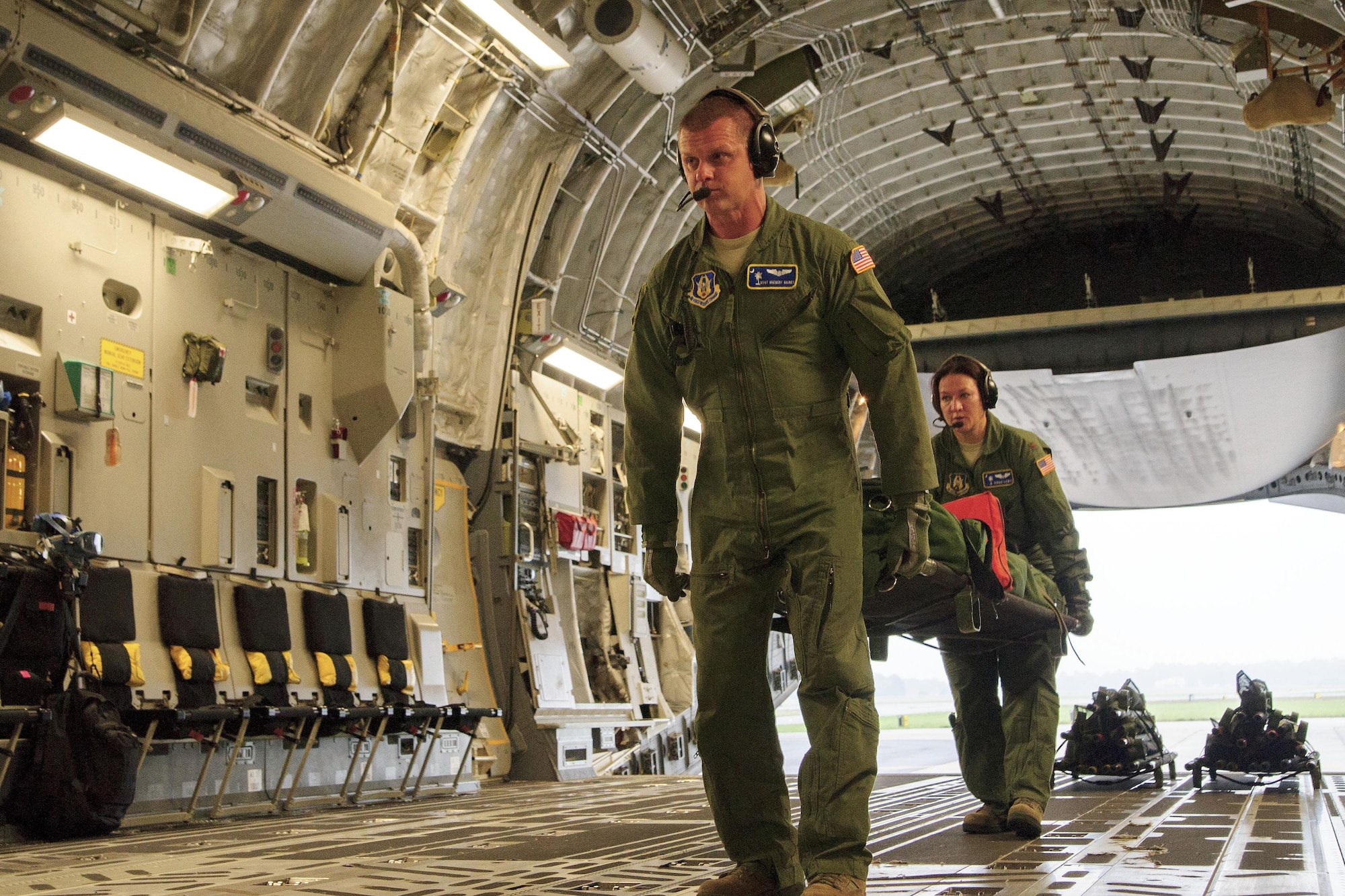 Members of the 315th Aeromedical Evacuation Squadron conduct training operations with the support from Civil Air Patrol volunteers onboard a C-17 Globemaster III, assigned to the 300th Airlift Squadron, near Joint Base Charleston, S.C., May 18, 2016. The squadrons conducted the training to enhance their ability to receive, regulate, transport and track patients to and from Natural Disaster Medical System hospitals near Greenville-Spartanburg International Airport. (U.S. Air Force photo by Senior Airman Jonathan Lane)