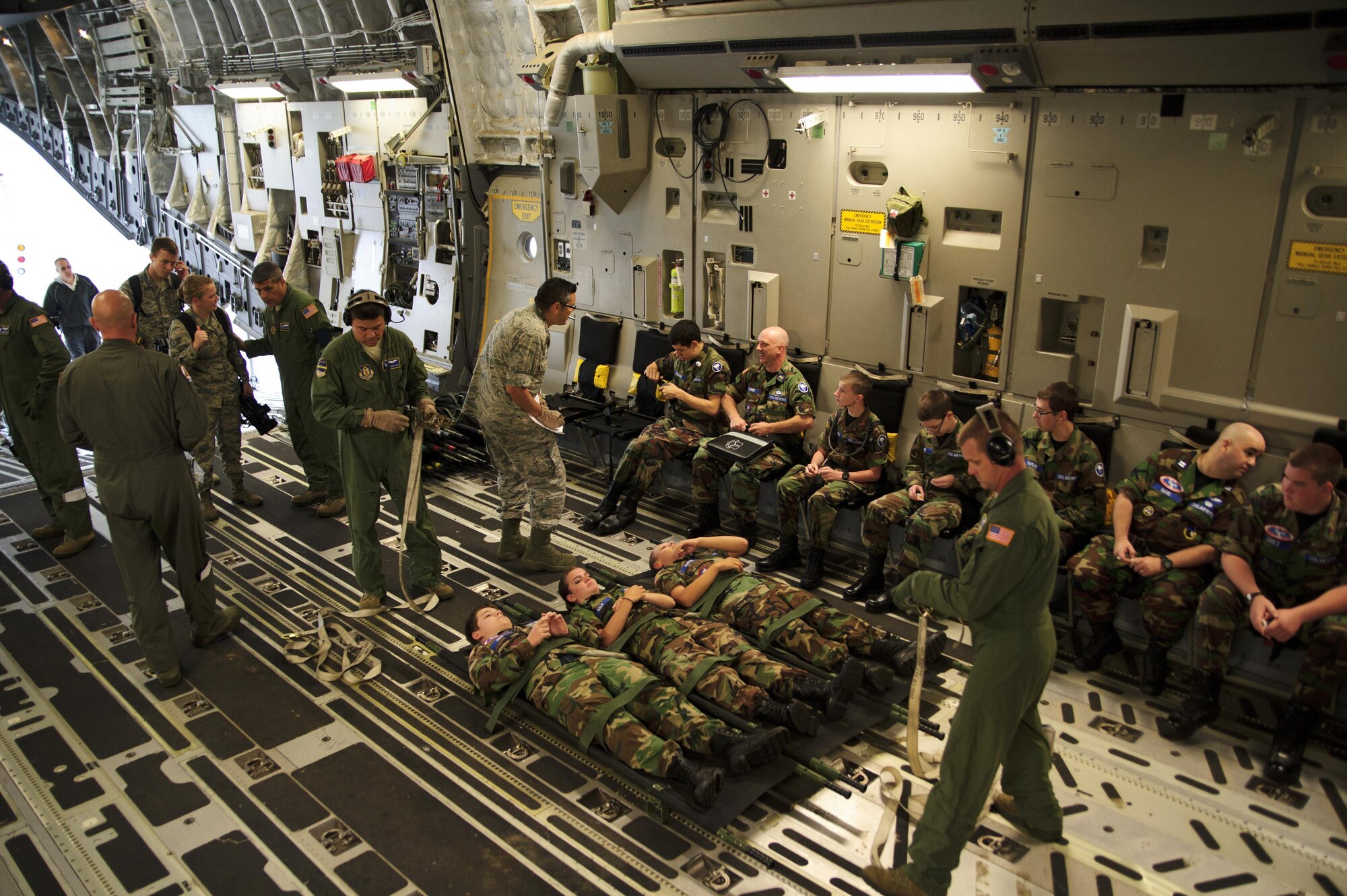 Members of the 315th Aeromedical Evacuation Squadron conduct training operations with the support from Civil Air Patrol volunteers onboard a C-17 Globemaster III, assigned to the 300th Airlift Squadron, near Joint Base Charleston, S.C., May 18, 2016. The squadrons conducted the training to enhance their ability to receive, regulate, transport and track patients to and from Natural Disaster Medical System hospitals near Greenville-Spartanburg International Airport. (U.S. Air Force photo by Senior Airman Jonathan Lane)