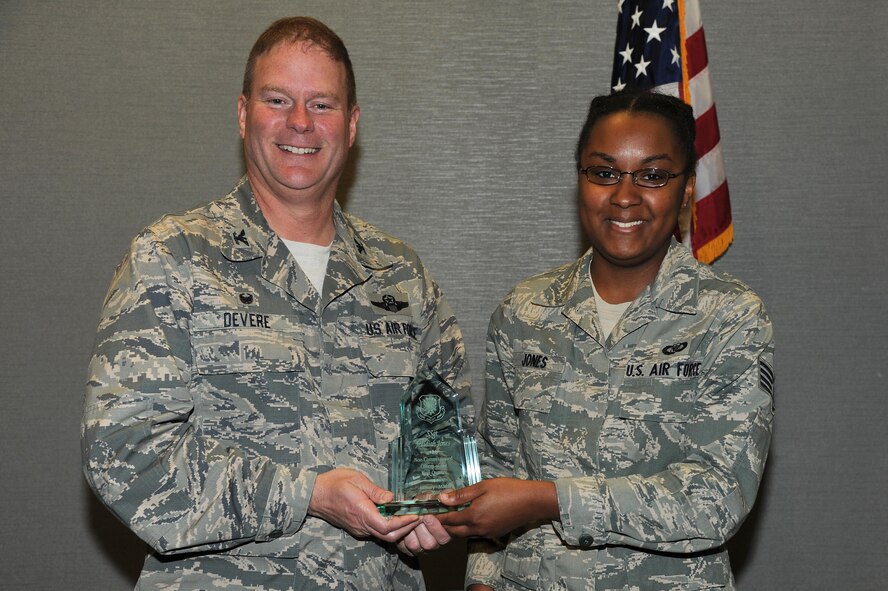 PETERSON AIR FORCE BASE, Colo. – Staff Sgt. Jedidiah Jones, an Emergency Action Controller and 302nd Airlift Wing Reservist assigned to the Colorado Springs Regional Command Post, was presented the 302nd AW Noncommissioned Officer of the First Quarter award by Col. James DeVere on May 14, 2016 here. DeVere, 302nd Airlift Wing commander, and Chief Master Sgt. Vicky Robertson, 302nd Airlift Wing command chief, recognized the 2016 quarterly award winners during the May Unit Training Assembly. (U.S. Air Force photo/Staff Sgt. Amber Sorsek)