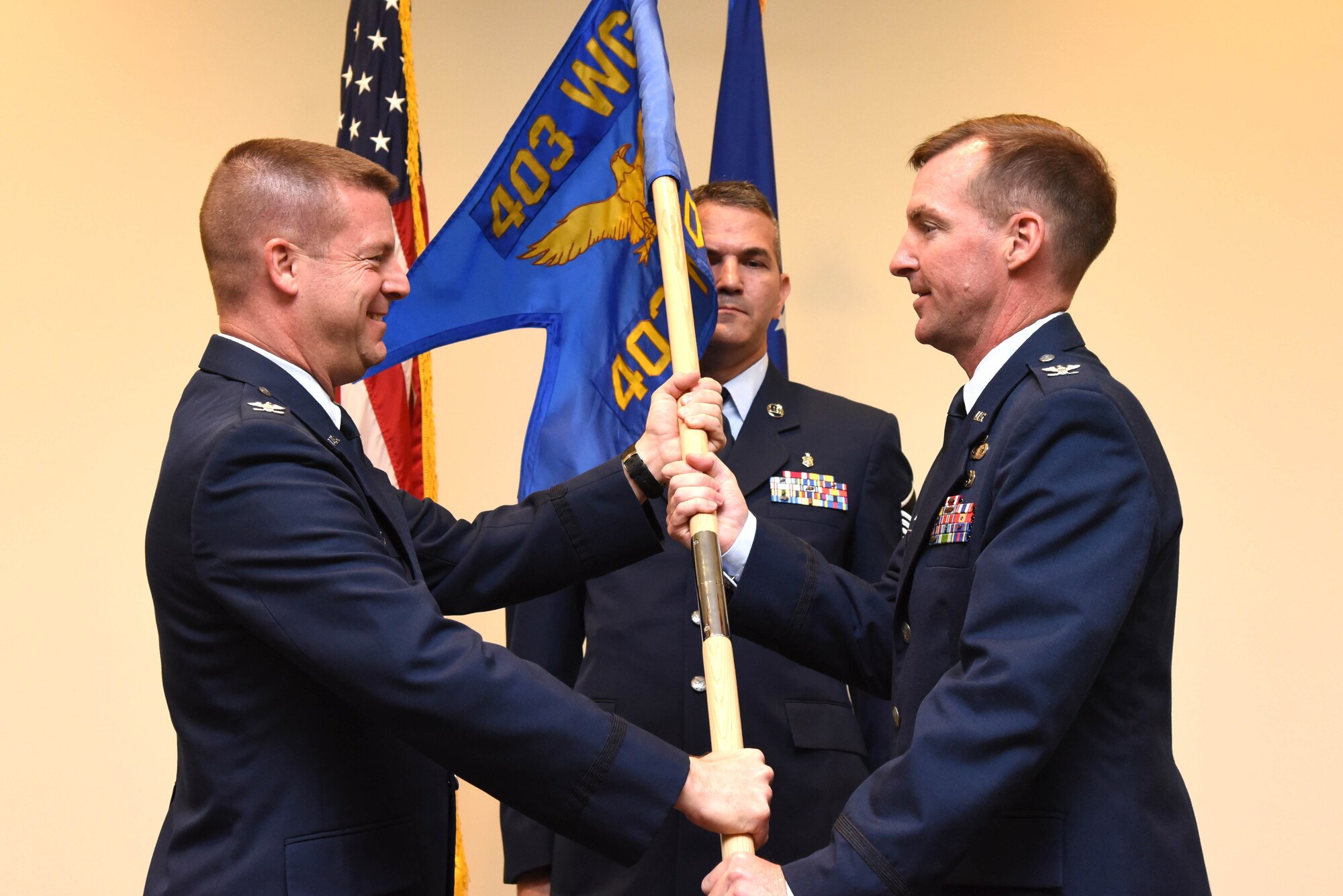 Col. Edward Segura (right) assumes command of the 403rd Mission Support Group in a ceremony presided over by Col. Frank Amodeo (left), 403rd Wing commander, May 15, 2016, at Keesler Air Force Base, Mississippi. Segura assumed command after a ceremony promoting him from lieutenant colonel to colonel that same day. (U.S. Air Force photo/Tech. Sgt. Ryan Labadens)