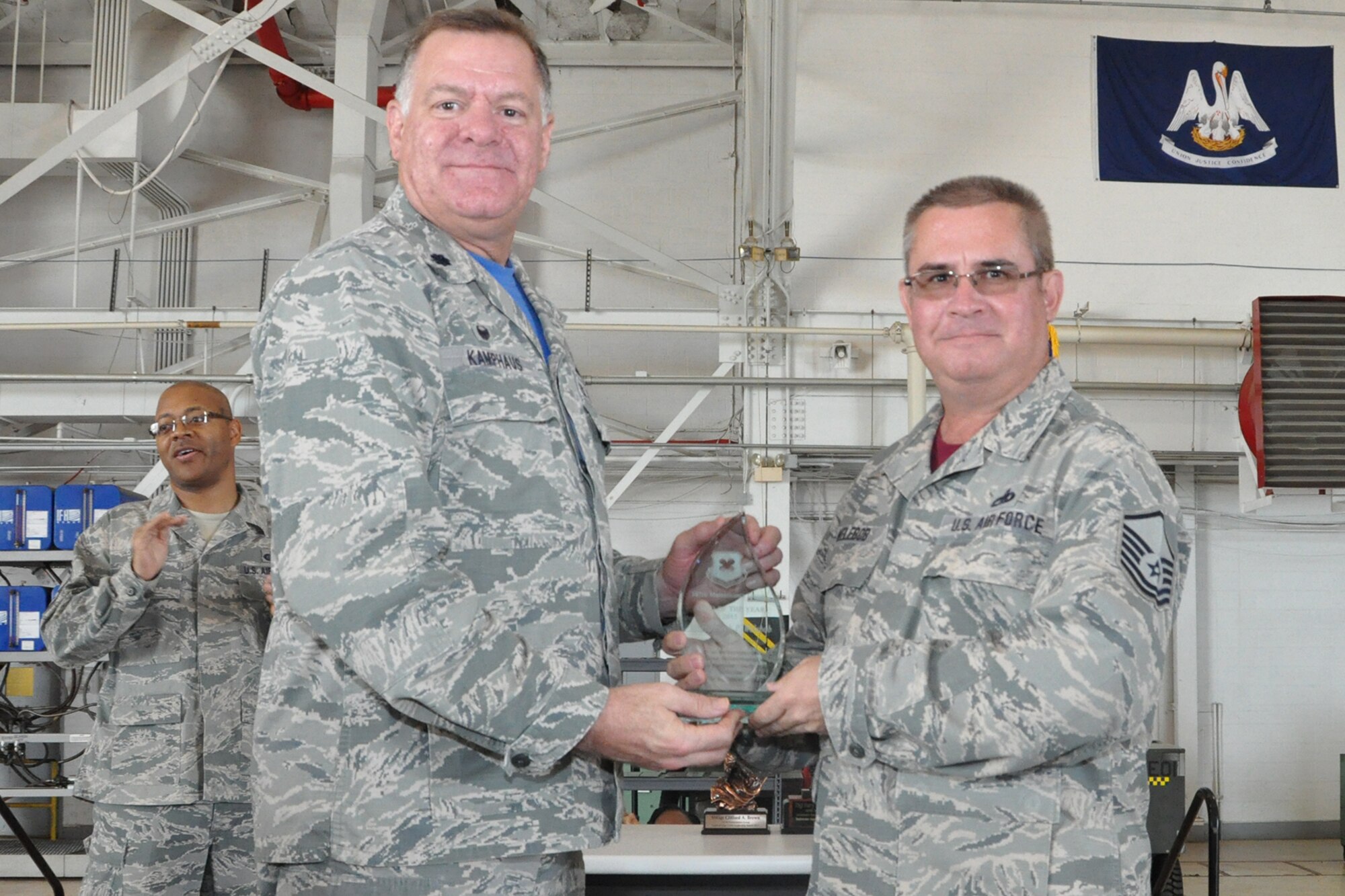 U.S. Air Force Lt. Col. Leo Kamphaus, 307th Maintenance Group (MXG) commander, presents an award to Master Sgt. Joseph Welebob during a Commander’s Call on May 15, 2016, Barksdale Air Force Base, La. Welebob is assigned to the 707th Maintenance Squadron and was selected as the 307th MXG Senior Non-Commissioned Officer of the Year for 2015. (U.S. Air Force photo by Master Sgt. Greg Steele/Released)
