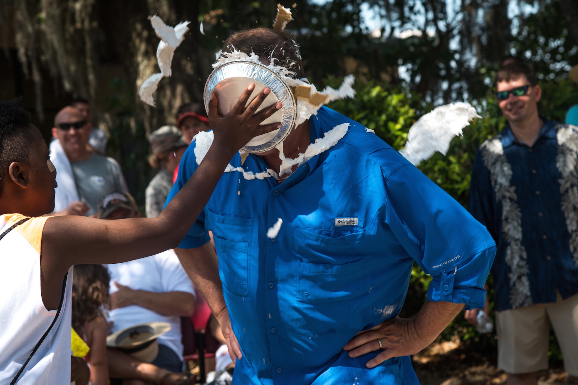 A 403rd Wing member receives a pie in the face during the Wing Spring Fling at Keesler Air Force Base, Mississippi, May 15, 2016. The "pie-in-the-face" and Wing Spring Fling was hosted by the 403rd Human Resource Development Council to allow leadership, Citizen Airmen, and their families a chance to interact and build camaraderie outside the work place. (U.S. Air Force photo/Staff Sgt. Shelton Sherrill)