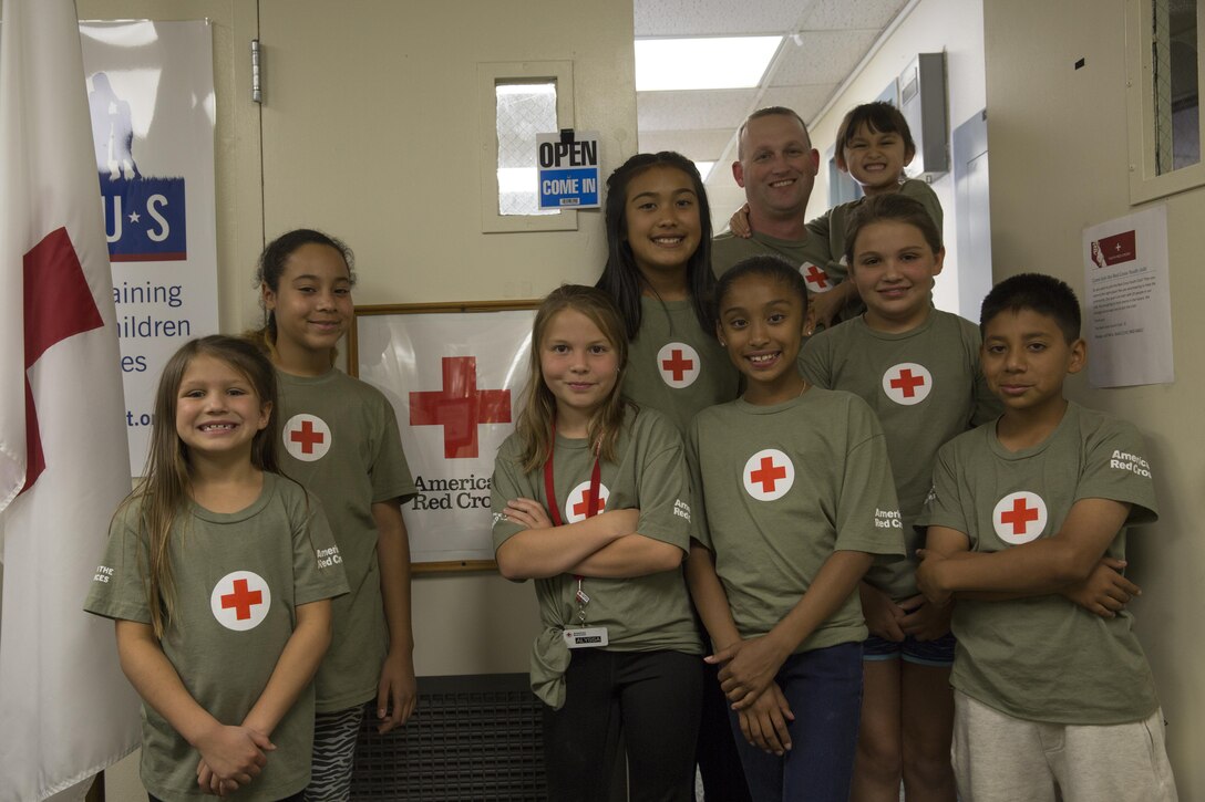Members of the American Red Cross Youth Club participate in the ARCYC’s Homework Helper Club at the Village Center May 5, 2016. The Homework Helper Club provides students with a supportive learning environment every Thursday at 5 p.m. (Official Marine Corps photo by Cpl. Connor Hancock/Released)