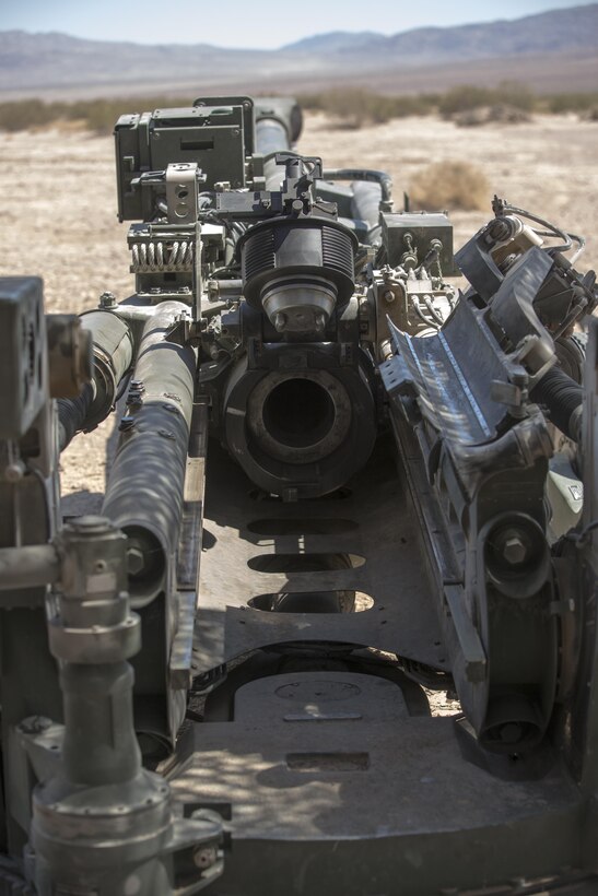 Marines with 3rd Battalion, 11th Marine Regiment, perform a field exercise of an M776 Chrome Tube for the 155mm M777A2 Lightweight Towered Howitzer in the Lead Mountain Training Area aboard the Marine Corps Air Ground Combat Center Twentynine Palms, Calif., May 3, 2016. Marines evaluated the durability and cleanability of the chrome-plating by firing 50 M232A1 top zone charges at an approximate rate of one round every 90 seconds. (Official Marine Corps photo by Lance Cpl. Levi Schultz/Released)